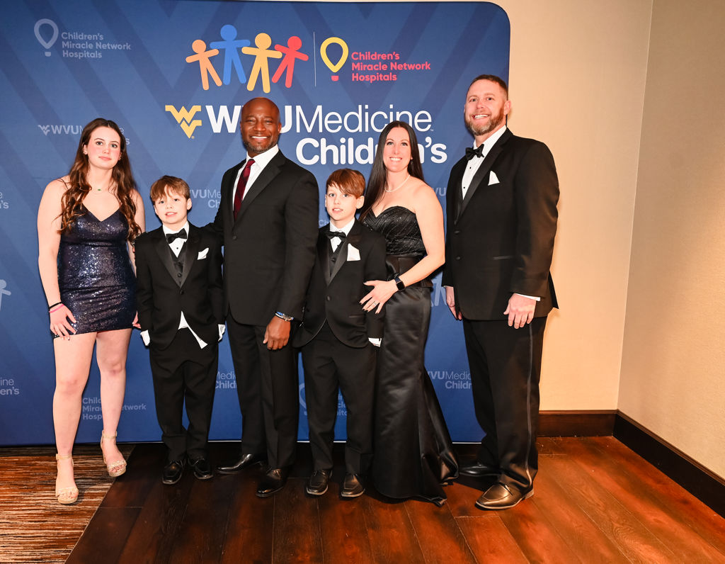 2025 Children's Miracle Network Hospitals Champion Child Jackson Pauley and his family with emcee Taye Diggs.